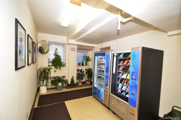 a utility room with dryer washer and other items