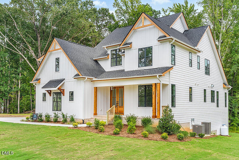 1210 Lake Wendell Road Wendell, NC 27591 - Photo 2 of 8 a front view of a house with a yard