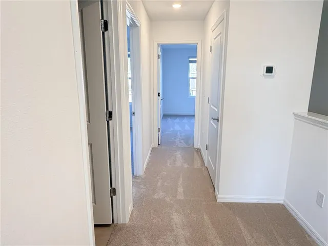 a kitchen with stainless steel appliances a refrigerator a stove a microwave and cabinets