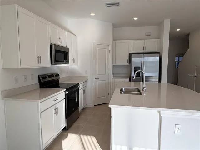 a view of a lake with a house in the background