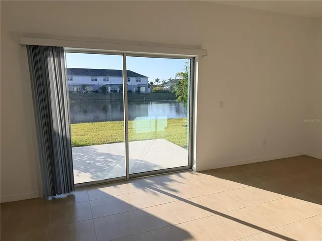 a view of an empty room and window