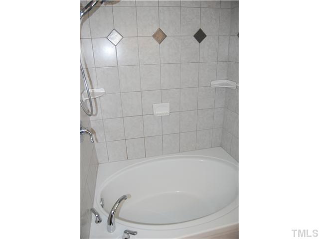 608 South Meadow Road Raleigh, NC 27603 - Photo 19 of 25 a bathroom with a bathtub