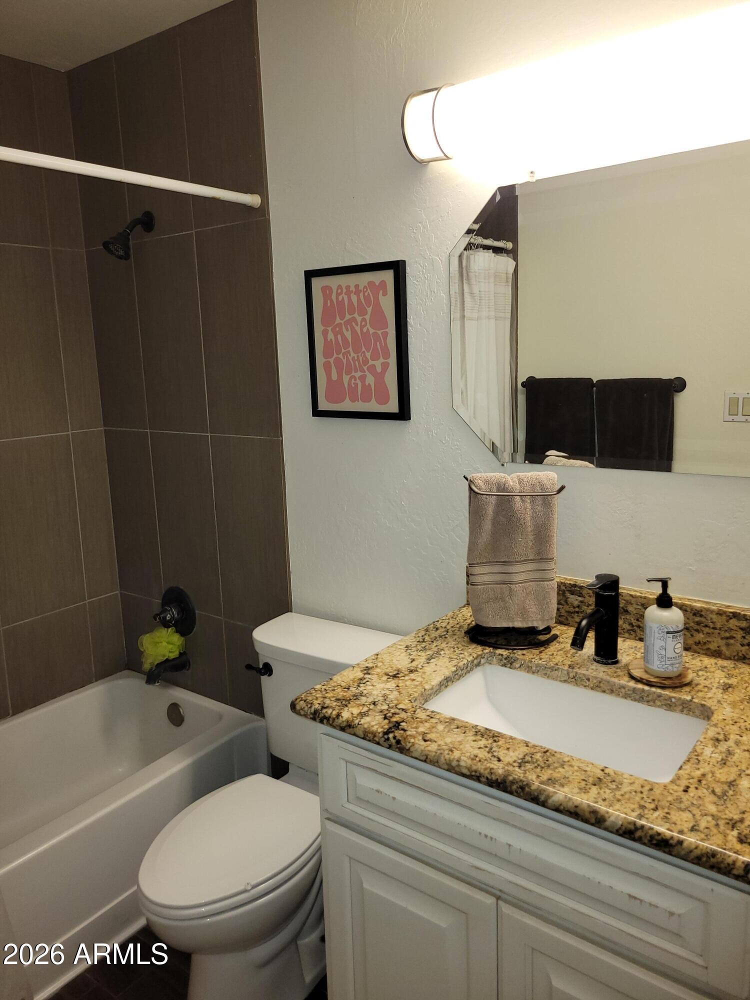6736 South Wilson Street Tempe, AZ 85283 - Photo 11 of 13 a bathroom with a granite countertop sink toilet and shower