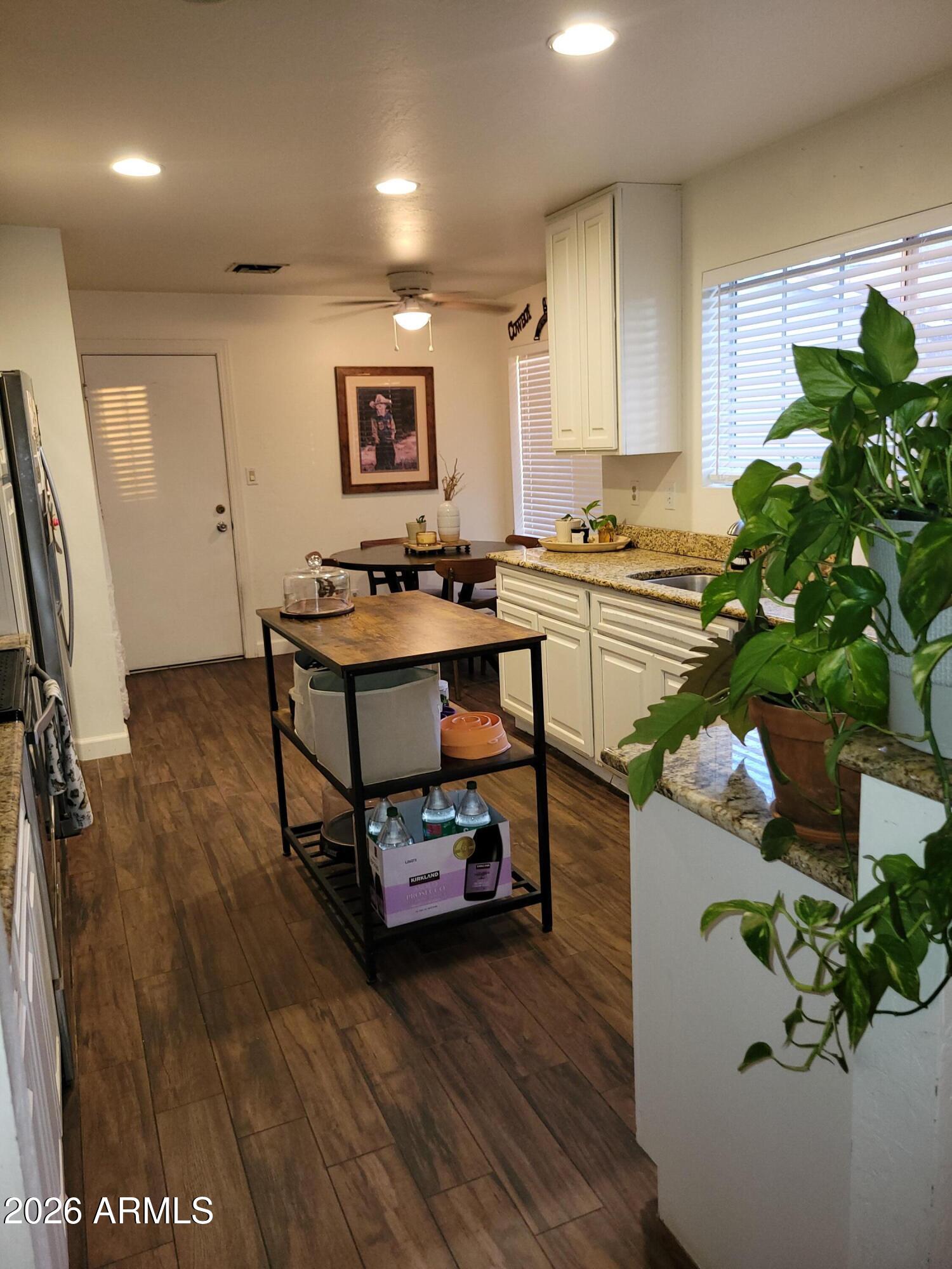 6736 South Wilson Street Tempe, AZ 85283 - Photo 7 of 13 a room with furniture and a potted plant