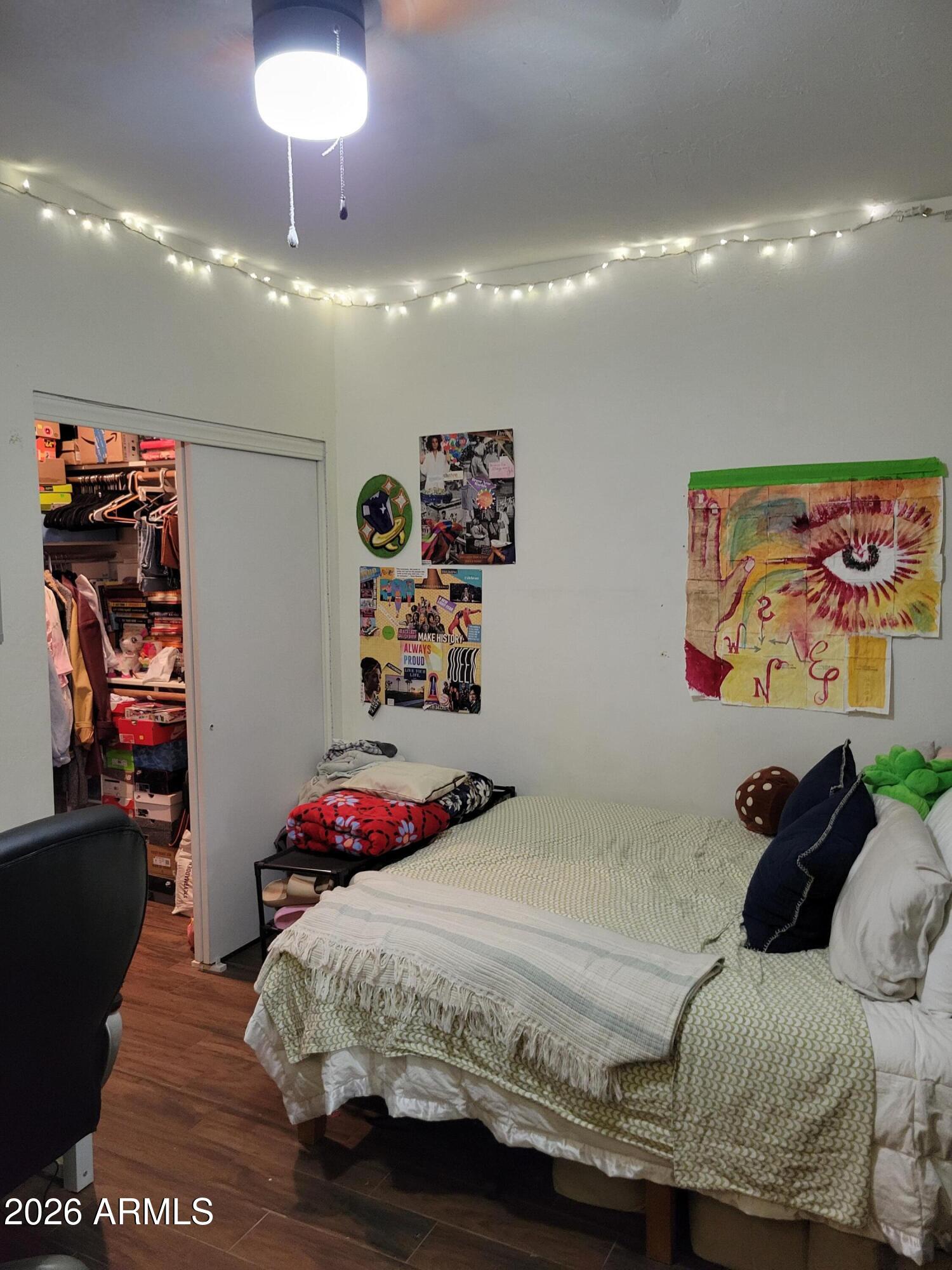 6736 South Wilson Street Tempe, AZ 85283 - Photo 10 of 13 a bedroom with a bed and a painting on the wall