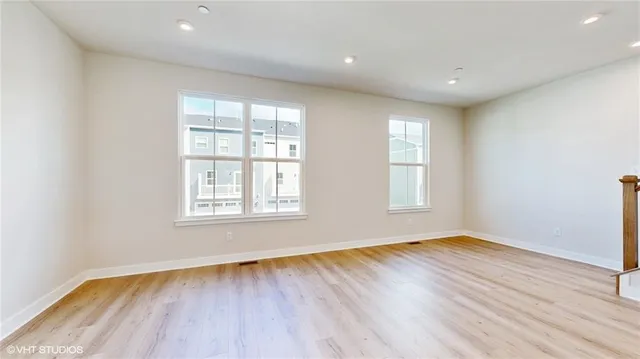 a view of kitchen with wooden floor and electronic appliances
