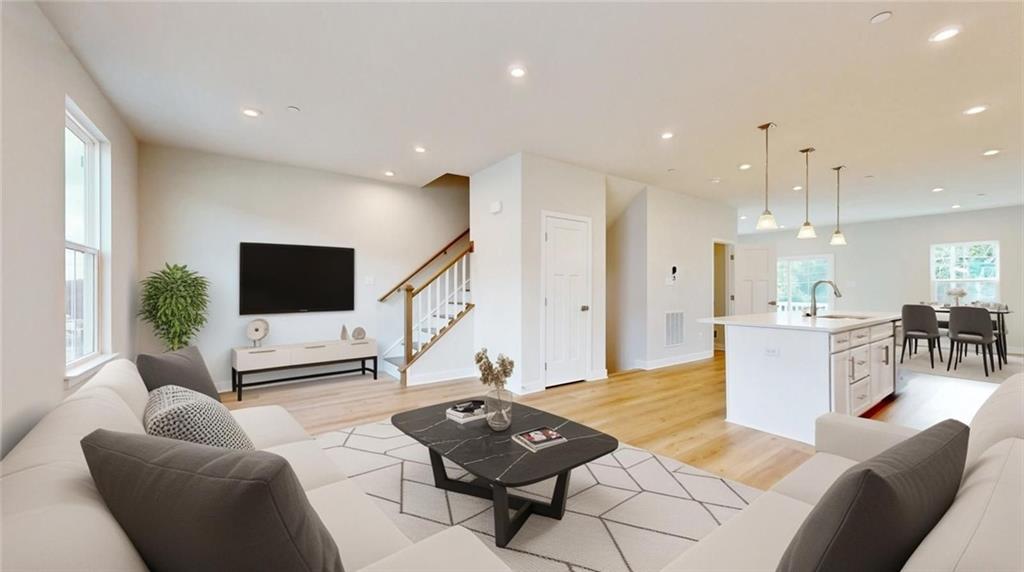 6804 Sycamore Way Gibsonia, PA 15044 - Photo 17 of 50 a living room with furniture a rug and a flat screen tv
