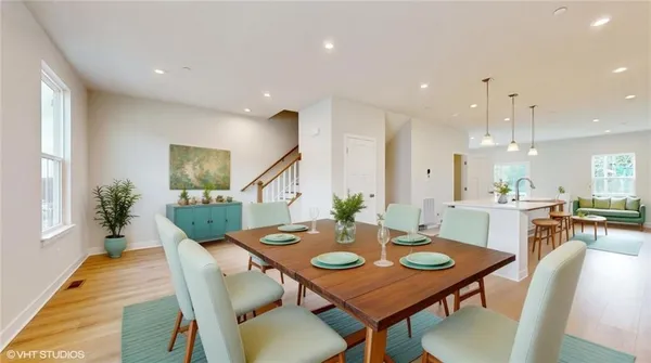 a view of kitchen with cabinets and wooden floor