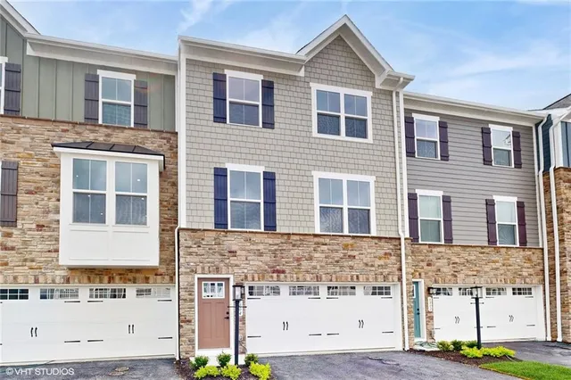 a front view of a building with a street