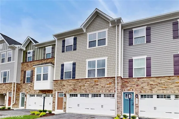 a view of building with glass windows
