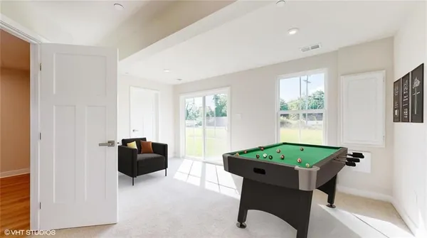 a living room with furniture and a table