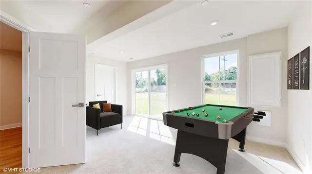 a living room with furniture and a table