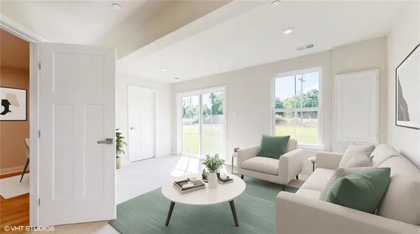 a living room with furniture and a window