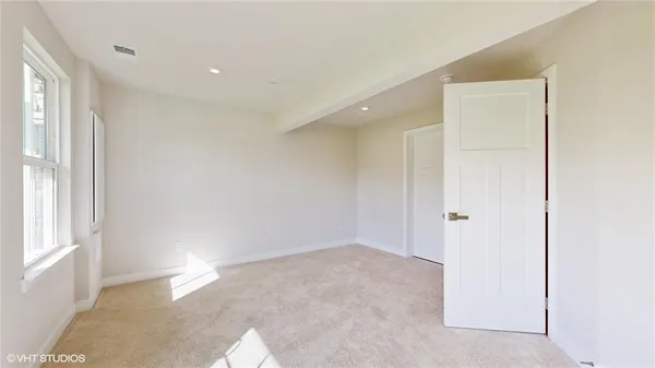 a bathroom with a bathtub shower sink vanity and toilet