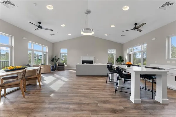 a view of a dining room with furniture window and wooden floor
