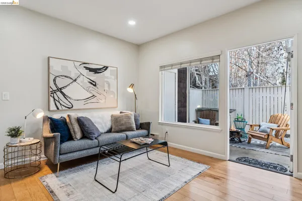 a living room with furniture and a window with outer view
