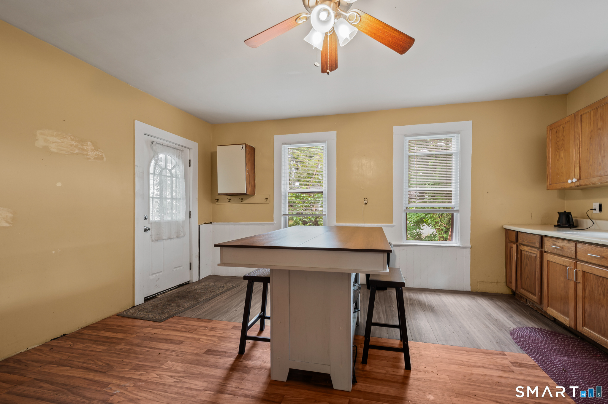 220 Murray Street Meriden, CT 06450 - Photo 5 of 28 a view of a kitchen with a table and chairs