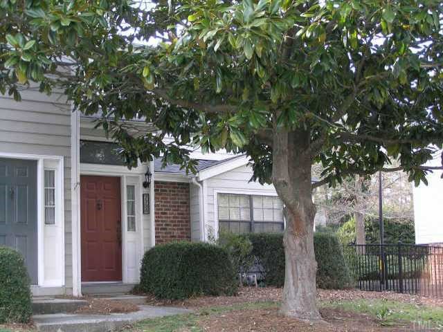 7734 Falcon Rest Circle Raleigh, NC 27615 - Photo 1 of 10 a front view of a house with garden