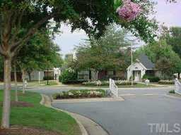 7734 Falcon Rest Circle Raleigh, NC 27615 - Photo 5 of 10 a front view of a house with a yard and trees