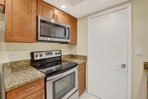 a kitchen with a stove and a microwave