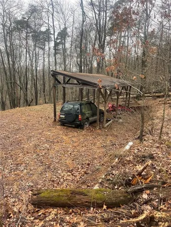 a view of outdoor space with deck and yard