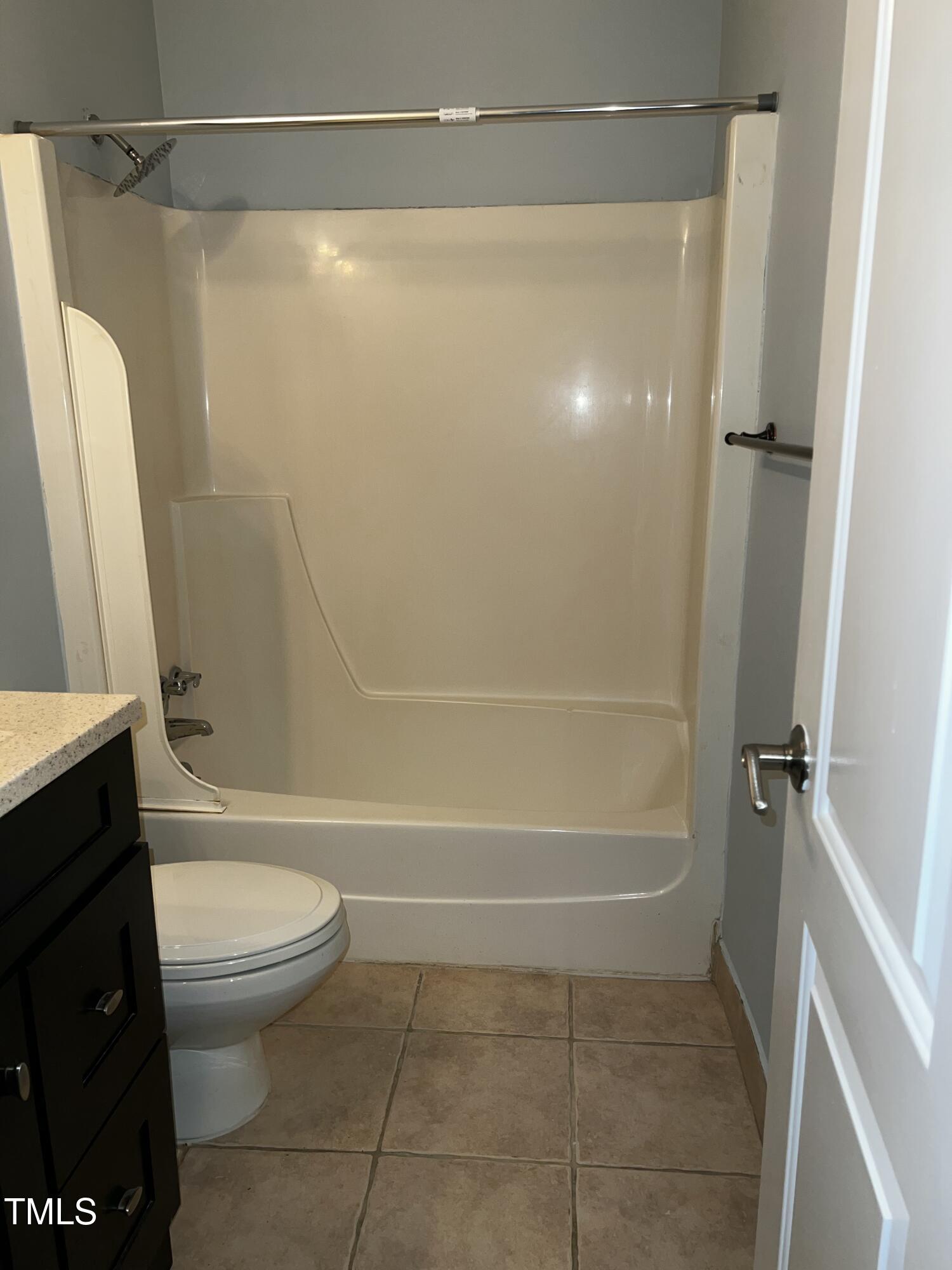 4519 Edwards Mill Road, Unit J Raleigh, NC 27612 - Photo 11 of 20 a bathroom with a shower a toilet and a shower