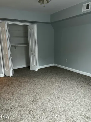 a view of an empty walk in closet
