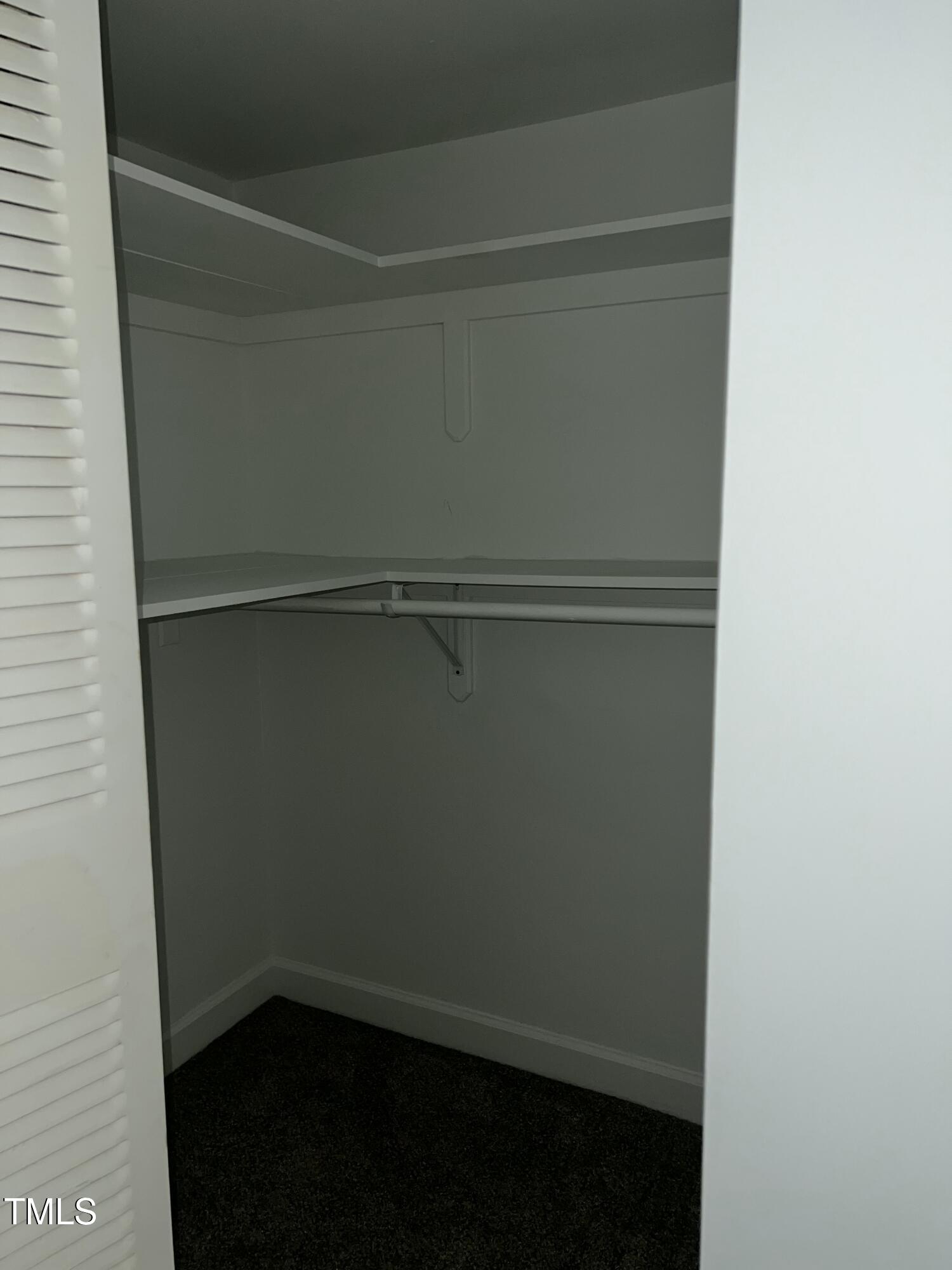 4519 Edwards Mill Road, Unit J Raleigh, NC 27612 - Photo 15 of 20 a view of an empty walk in closet
