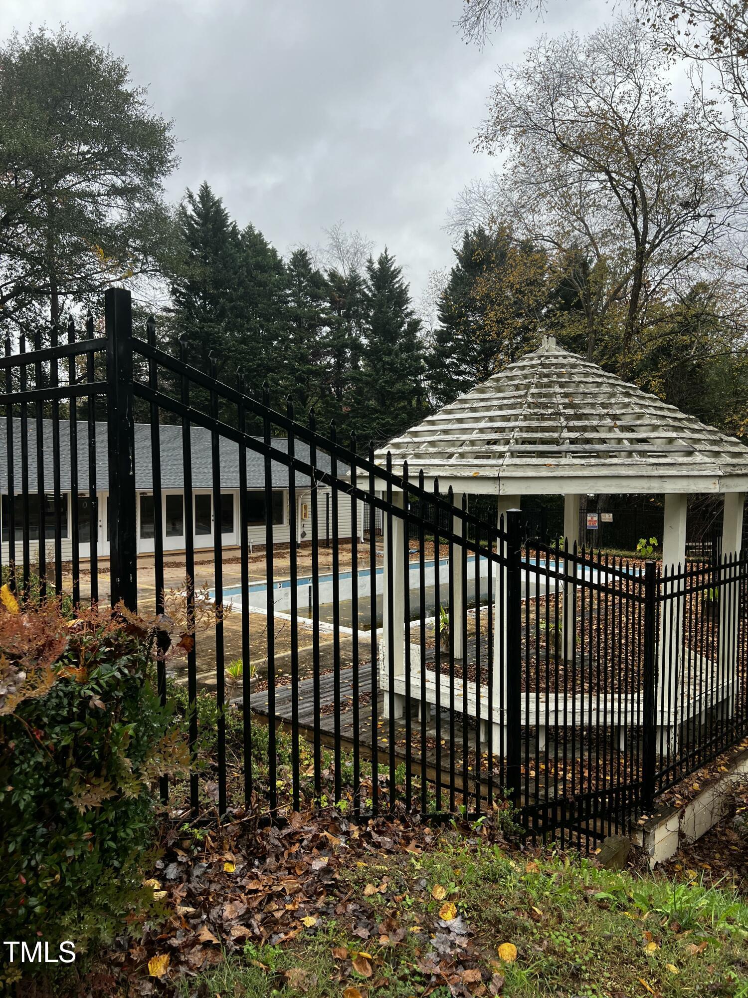 4519 Edwards Mill Road, Unit J Raleigh, NC 27612 - Photo 20 of 20 a front view of a house with a garden