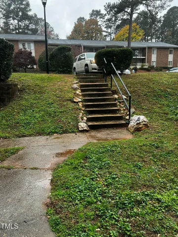 a view of door with wooden door