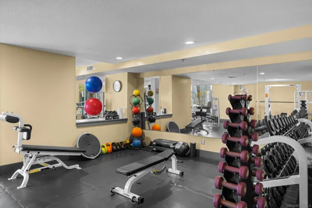 a view of a building with sitting area and furniture