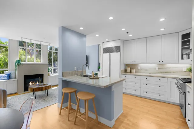 a kitchen with sink cabinets and fireplace