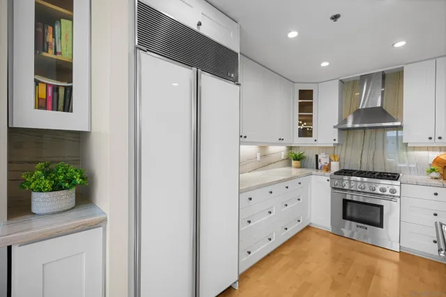 a kitchen with cabinets and a stove