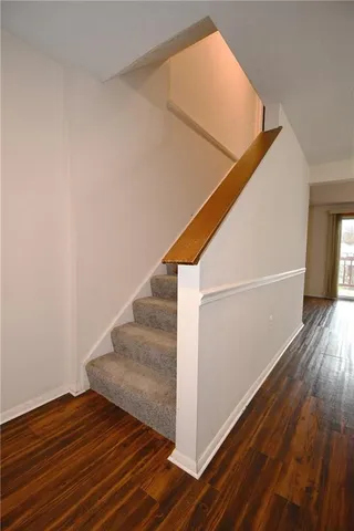 a view of entryway with wooden floor