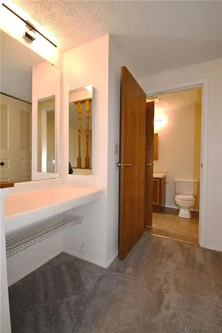 a view of a bathroom with a tub and a bathroom view
