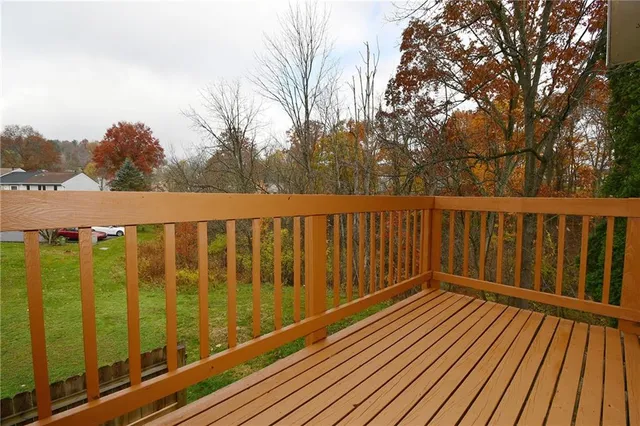 a view of wooden balcony with outdoor space
