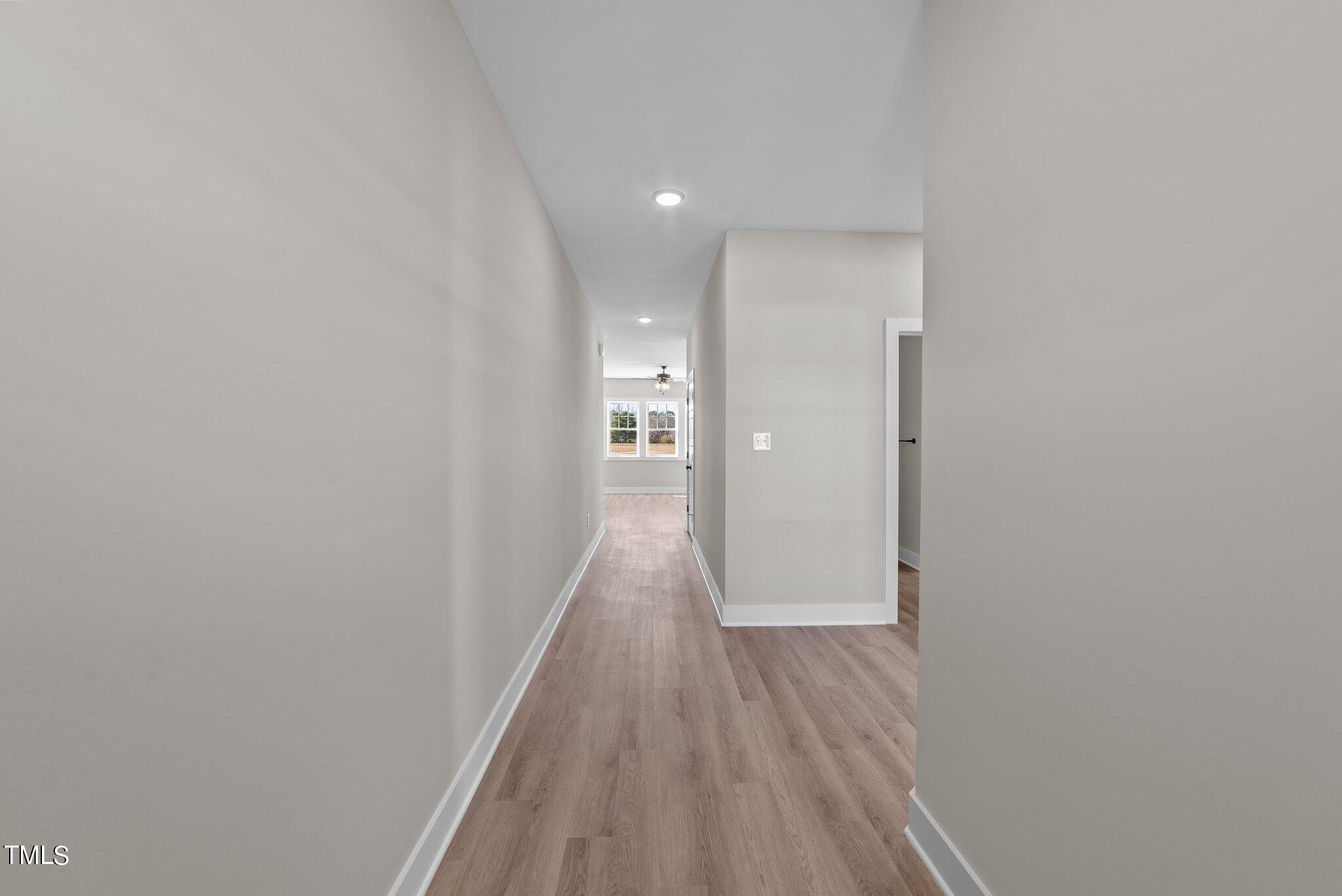 6041 Farmwood Loop Wilson, NC 27896 - Photo 2 of 38 a view of a hallway with wooden floor