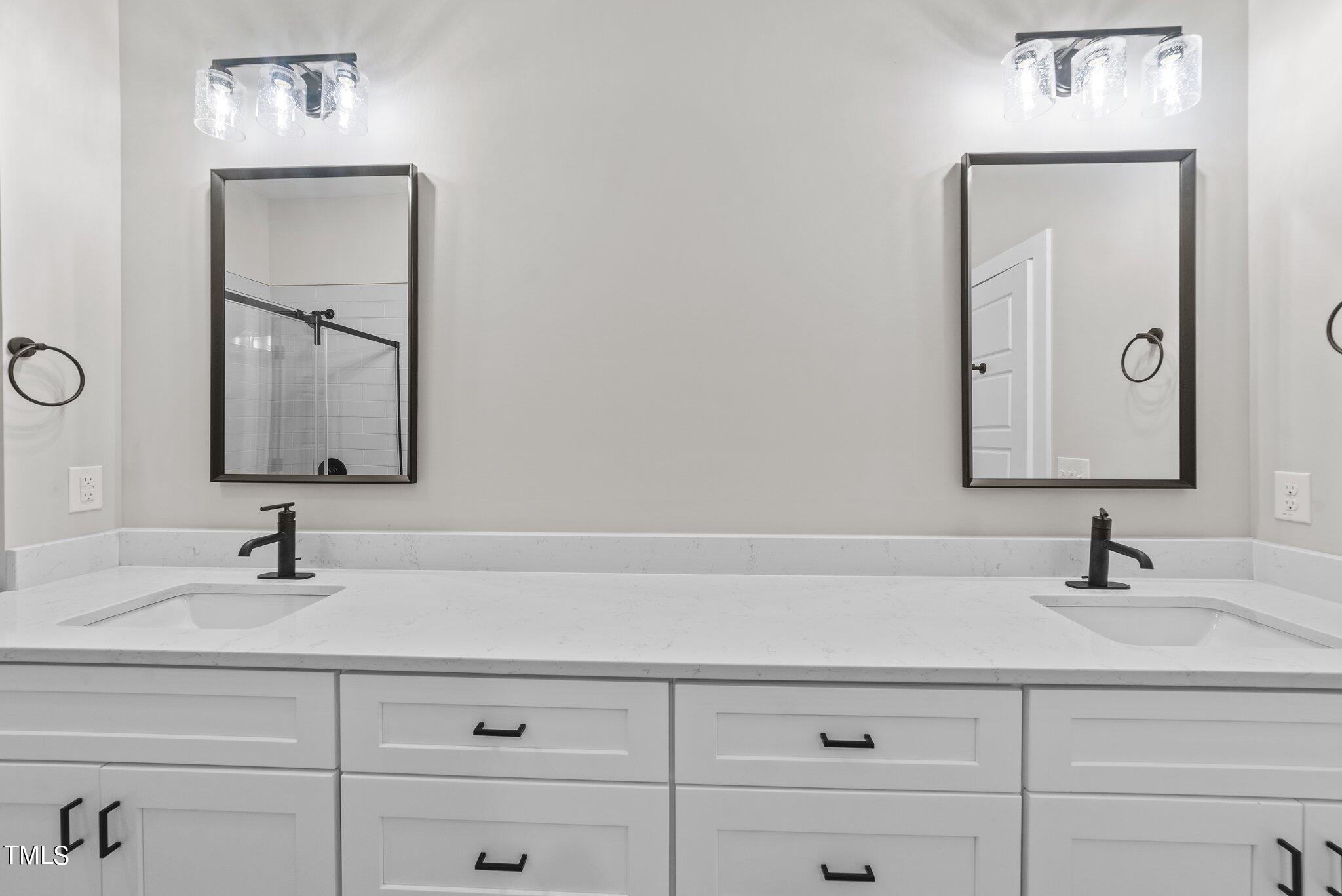 6041 Farmwood Loop Wilson, NC 27896 - Photo 21 of 38 a bathroom with a sink and a mirror