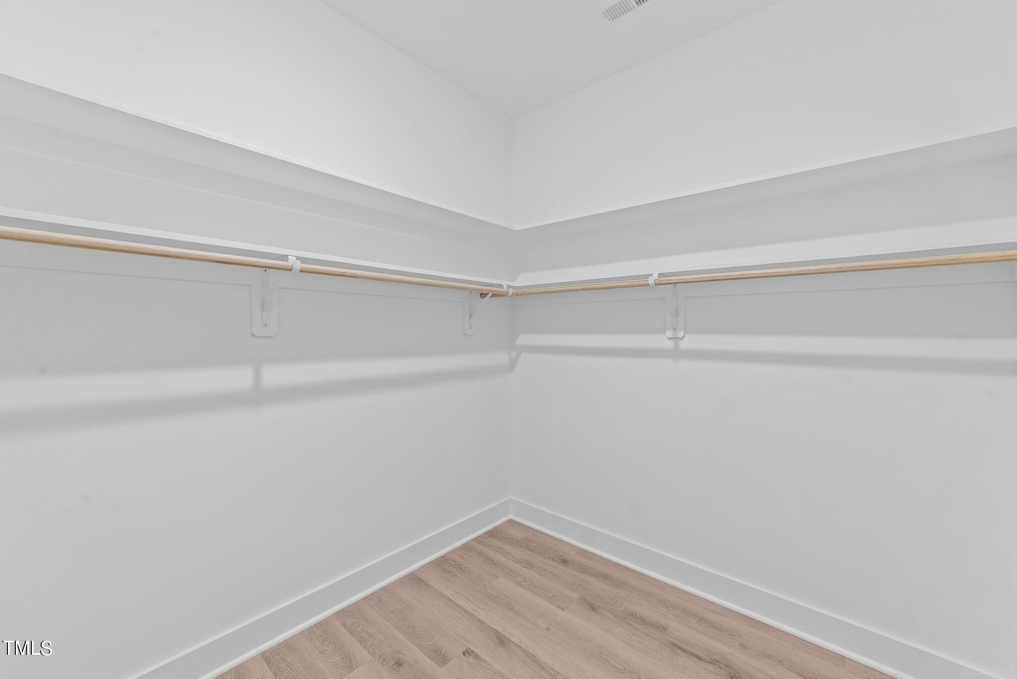 6041 Farmwood Loop Wilson, NC 27896 - Photo 23 of 38 a view of a room with shelf on the wall