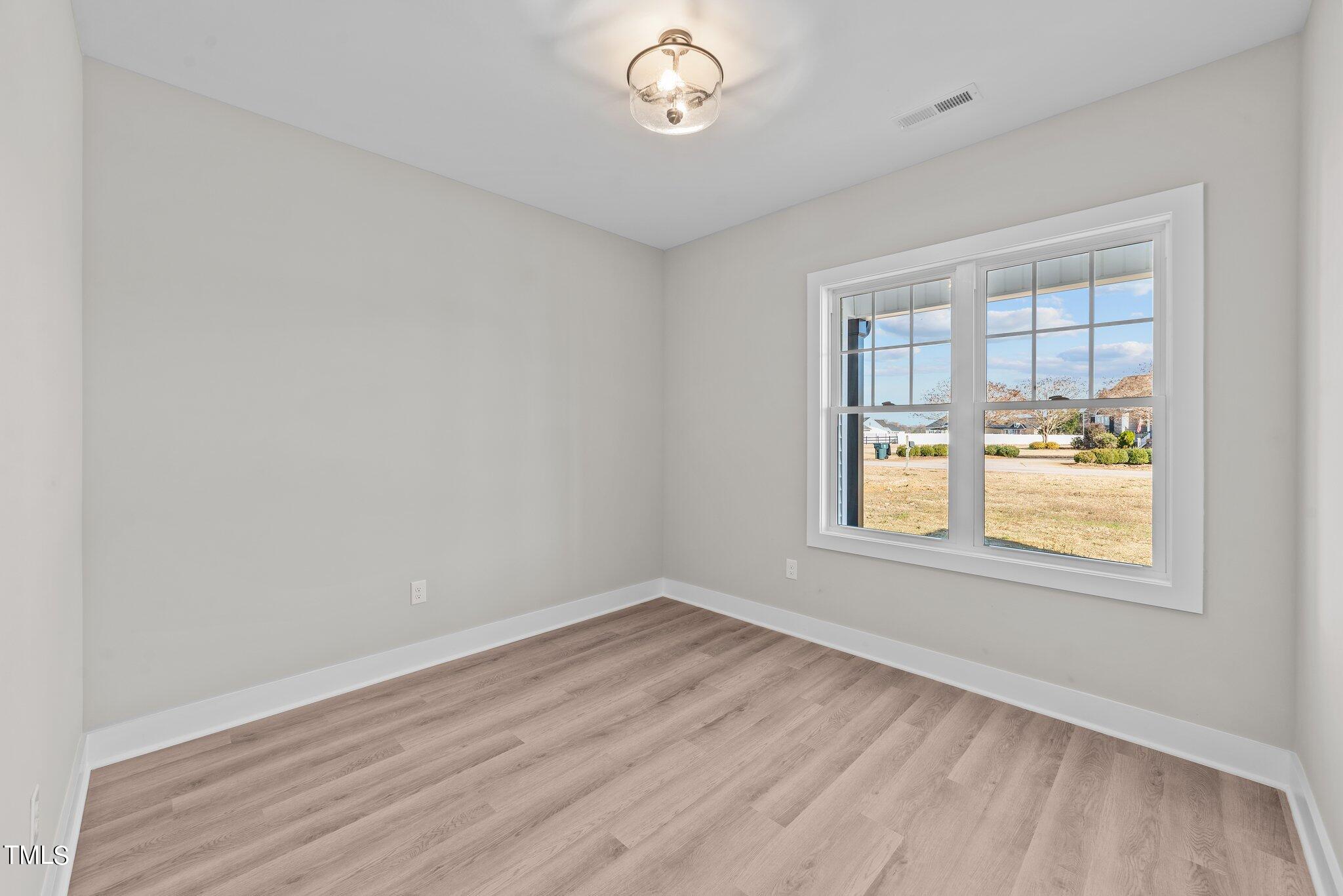 6041 Farmwood Loop Wilson, NC 27896 - Photo 24 of 38 an empty room with a window