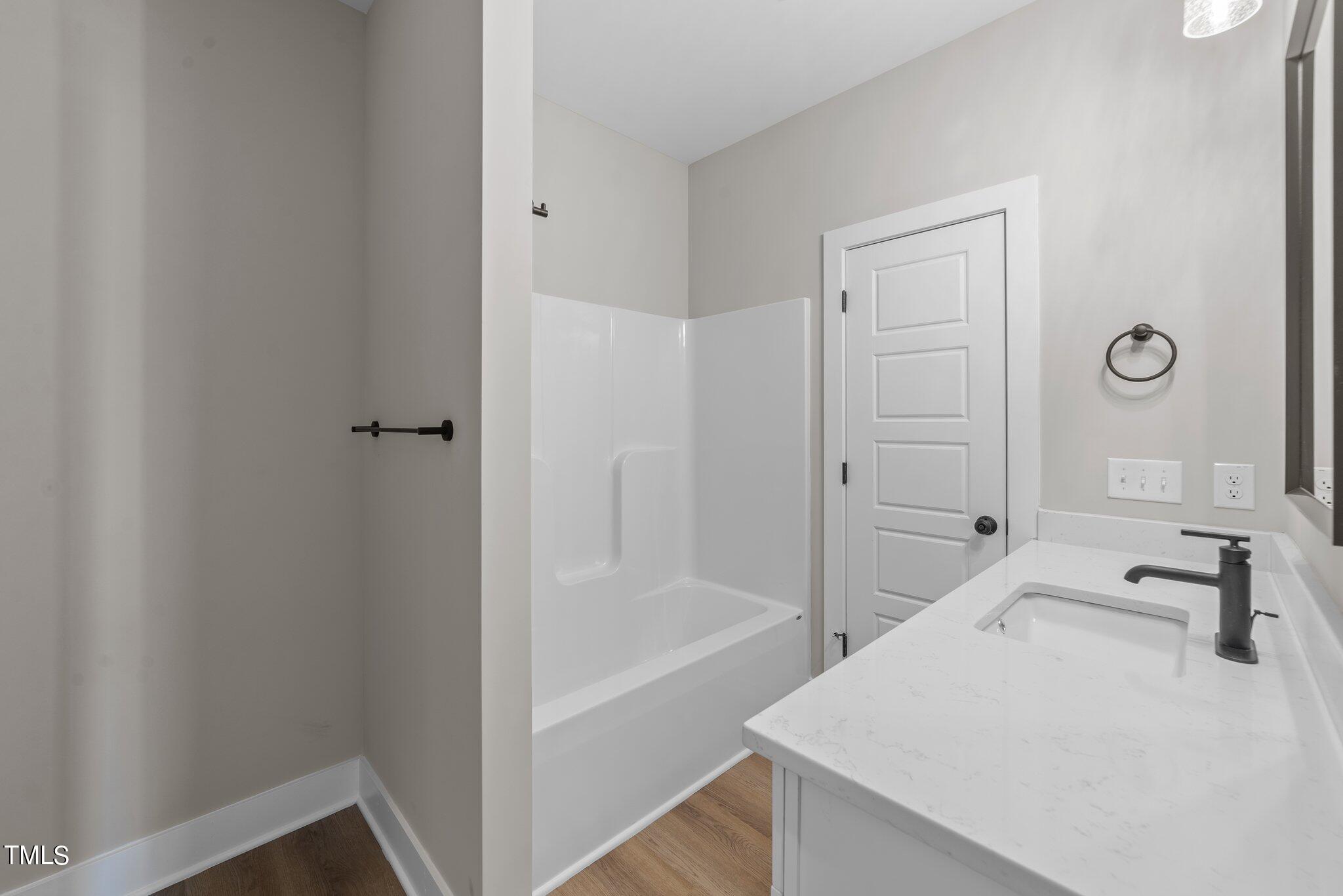 6041 Farmwood Loop Wilson, NC 27896 - Photo 31 of 38 a bathroom with a bathtub and a sink