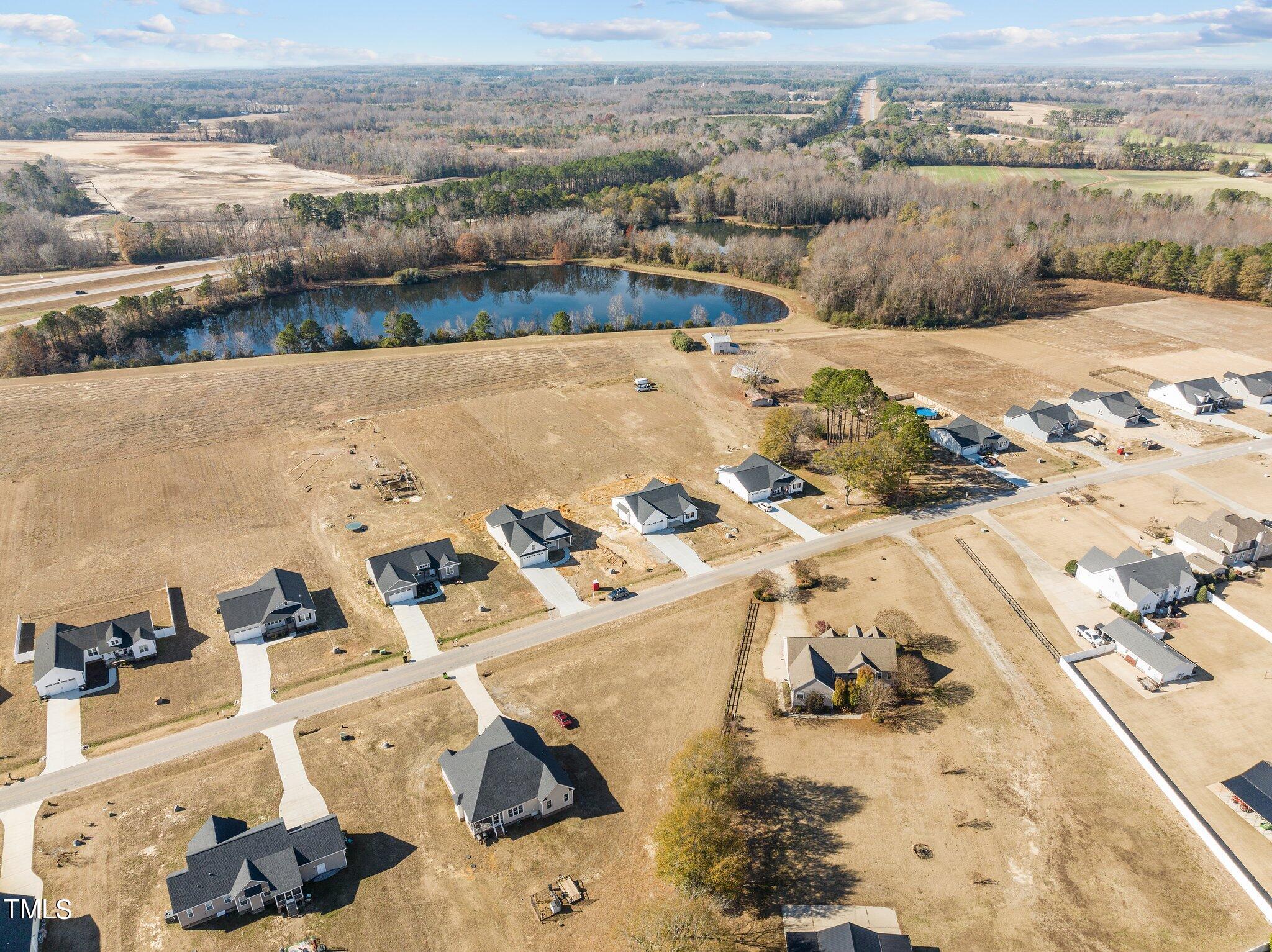 6041 Farmwood Loop Wilson, NC 27896 - Photo 38 of 38 an aerial view of a house with a ocean view