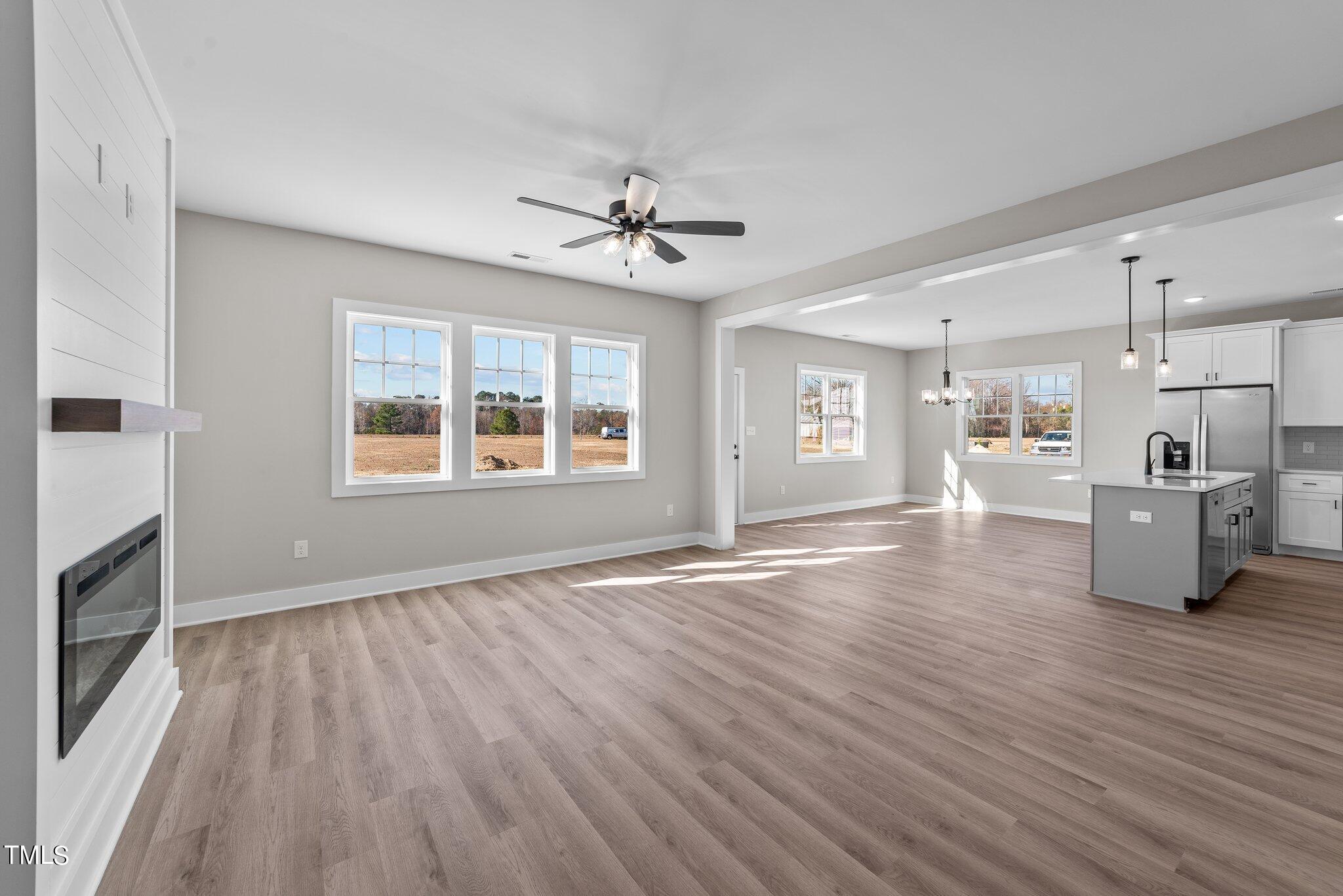6041 Farmwood Loop Wilson, NC 27896 - Photo 4 of 38 a view of a kitchen with stove and wooden floor