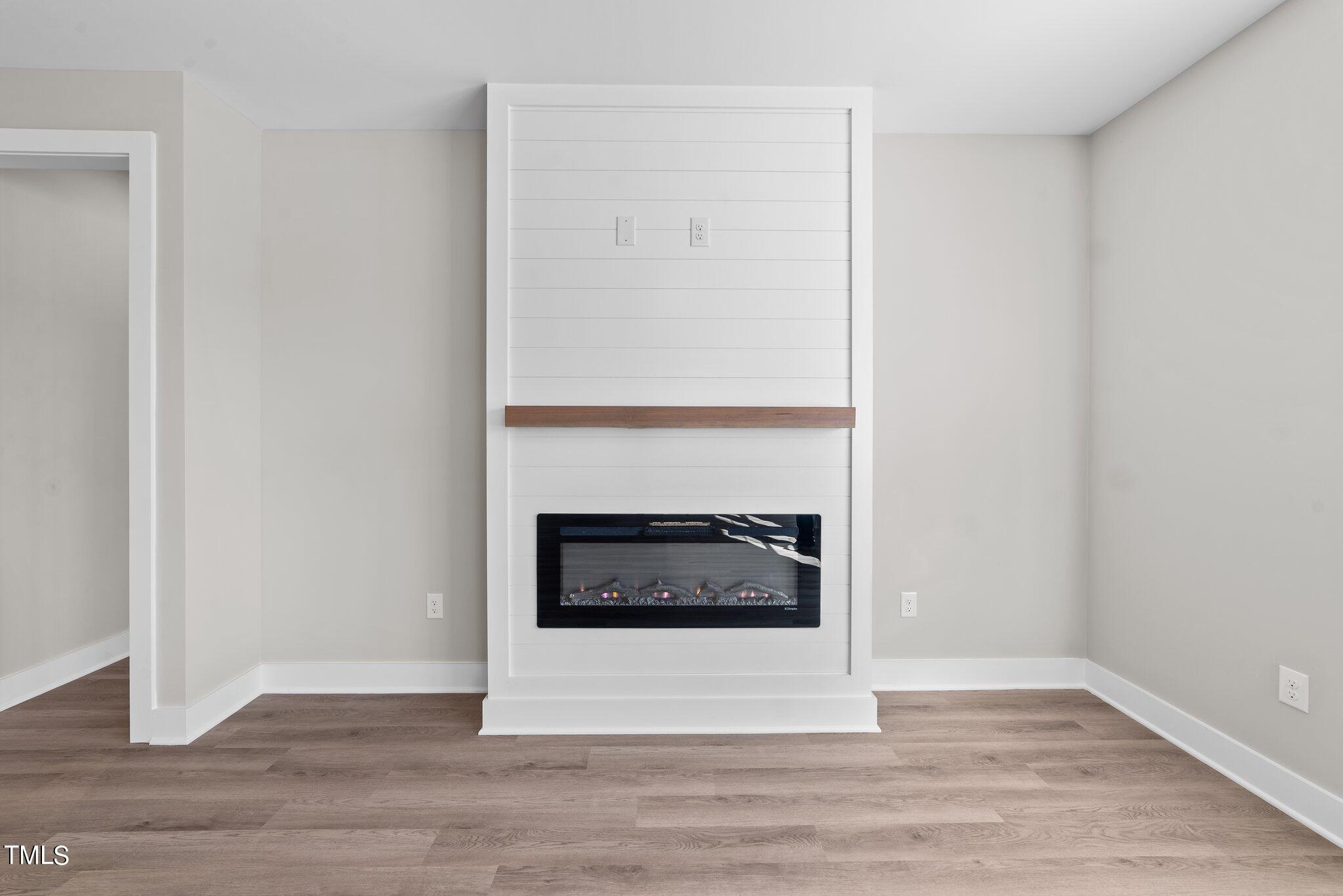 6041 Farmwood Loop Wilson, NC 27896 - Photo 6 of 38 a living room with a fireplace and a rug