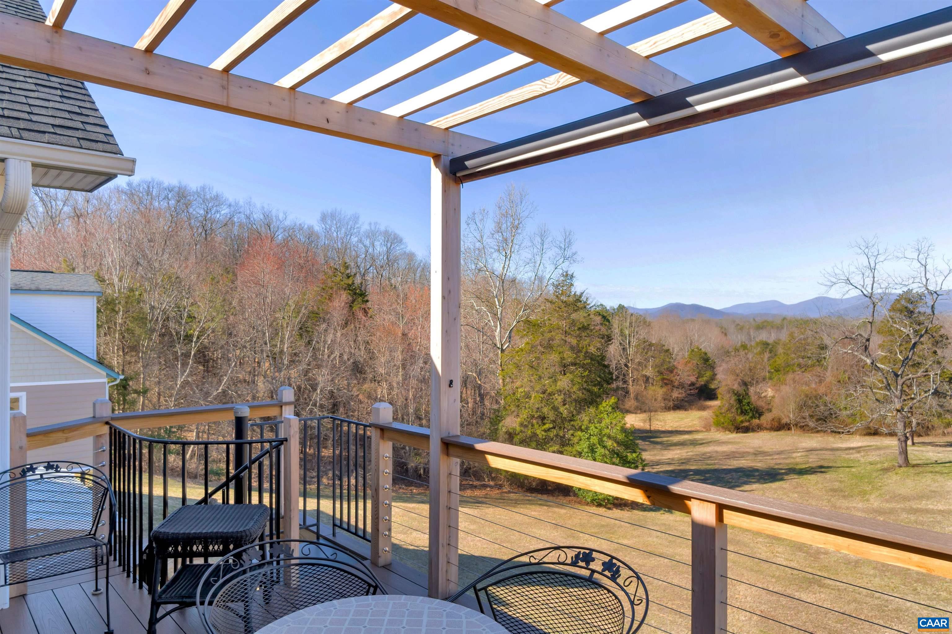 671 Swift Run Road Ruckersville, VA 22968 - Photo 8 of 68 a view of a porch with furniture and a yard