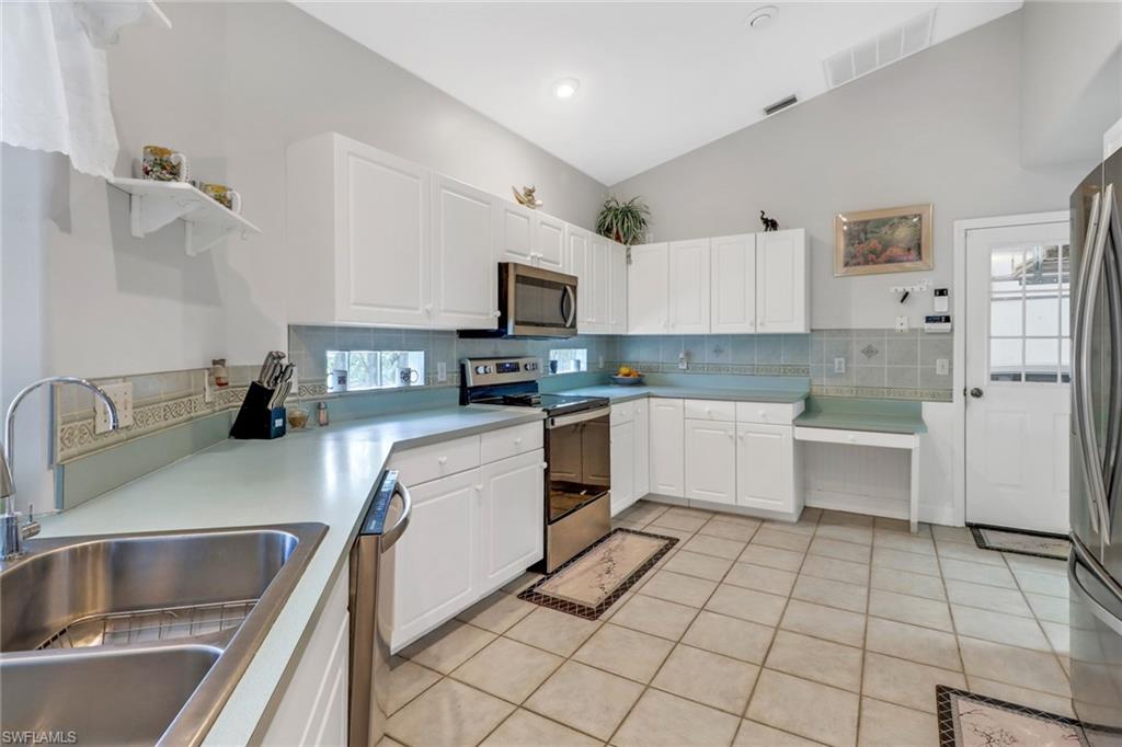 17532 Ingram Road Fort Myers, FL 33967 - Photo 17 of 46 a kitchen with cabinets a sink and appliances