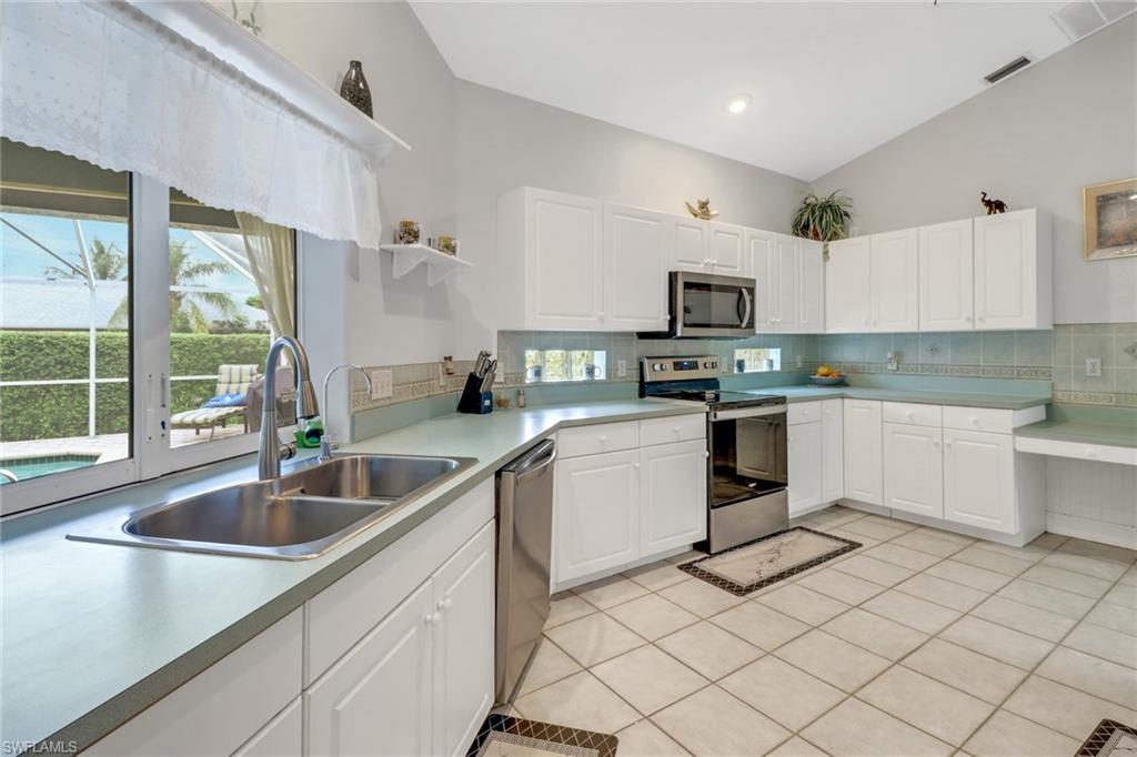 17532 Ingram Road Fort Myers, FL 33967 - Photo 18 of 46 a kitchen with a sink cabinets and window