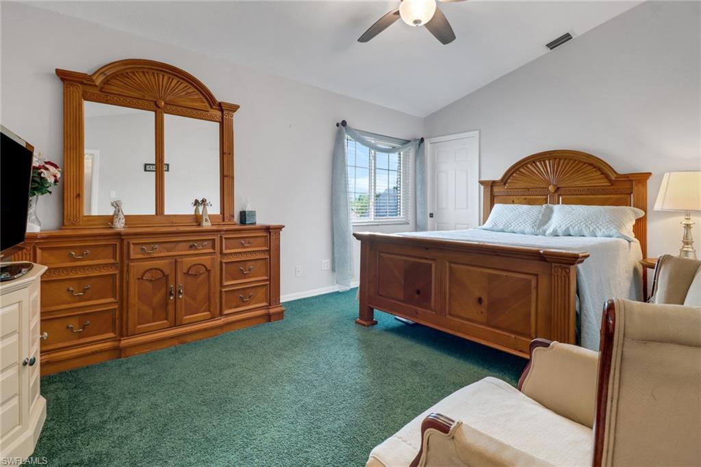 17532 Ingram Road Fort Myers, FL 33967 - Photo 24 of 46 a bedroom with a bed and a dresser
