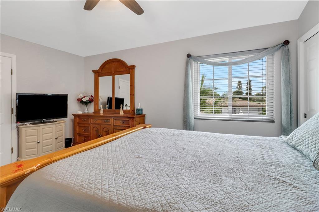 17532 Ingram Road Fort Myers, FL 33967 - Photo 25 of 46 a bedroom with a bed and a flat screen tv