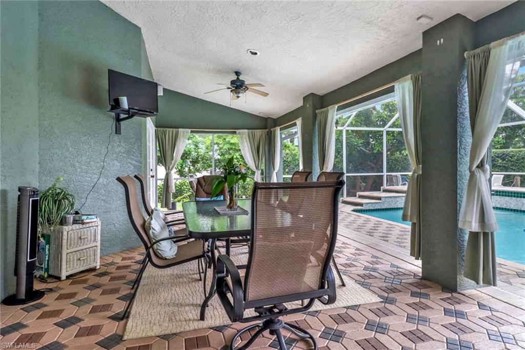 17532 Ingram Road Fort Myers, FL 33967 - Photo 28 of 46 a dining room with furniture a chandelier and wooden floor